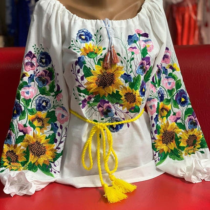 Women's embroidered blouse with a floral embroidery design