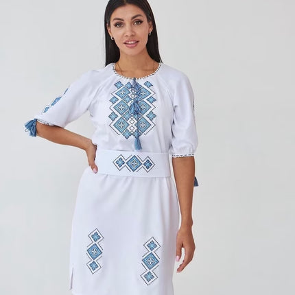 Women's embroidered dress in white color with a geometric ornament