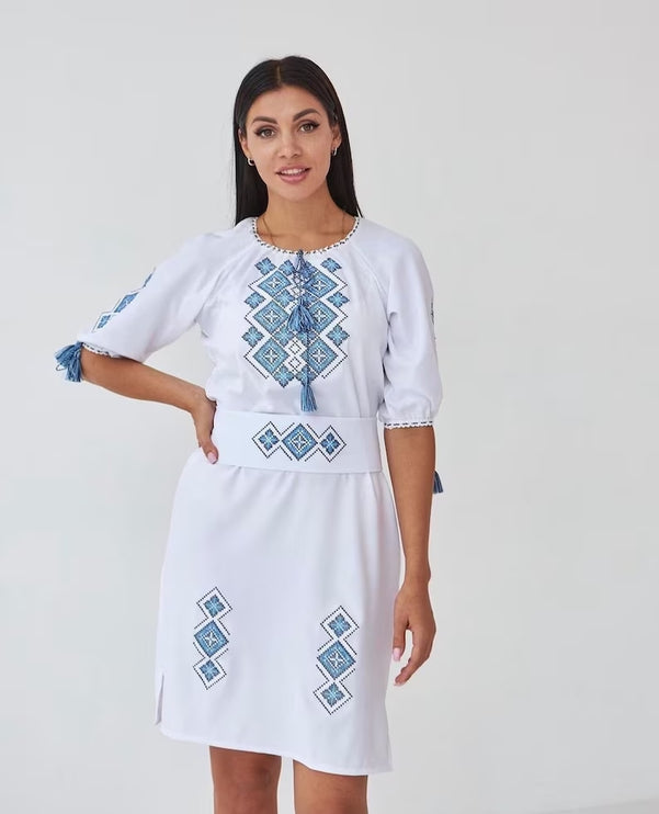 Women's embroidered dress in white color with a geometric ornament