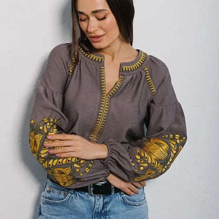 Women's embroidered blouse in graphite color with smooth floral patterns on the sleeves