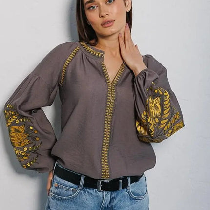 Women's embroidered blouse in graphite color with smooth floral patterns on the sleeves