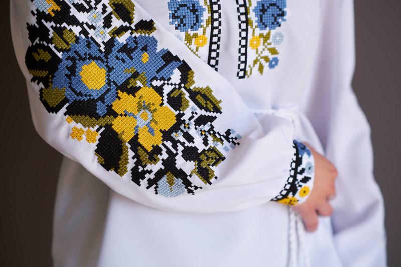 Women's embroidered blouse with blue and yellow embroidery