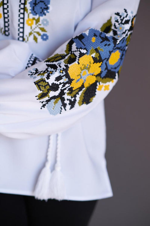 Women's embroidered blouse with blue and yellow embroidery