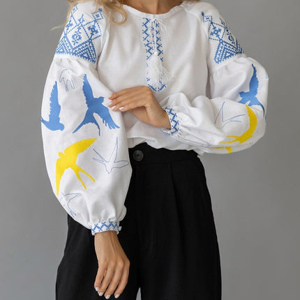 Women's embroidered blouse with swallows in Ukrainian style