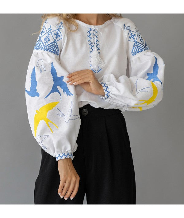 Women's embroidered blouse with swallows in Ukrainian style