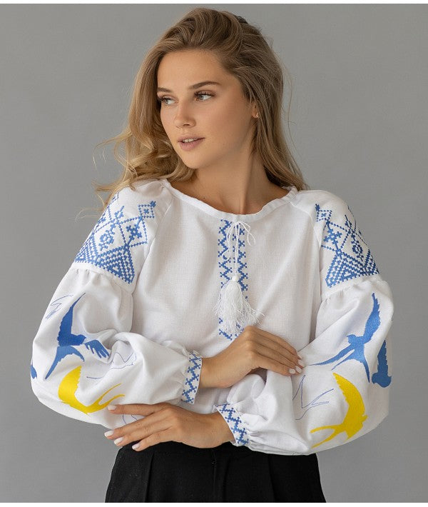 Women's embroidered blouse with swallows in Ukrainian style