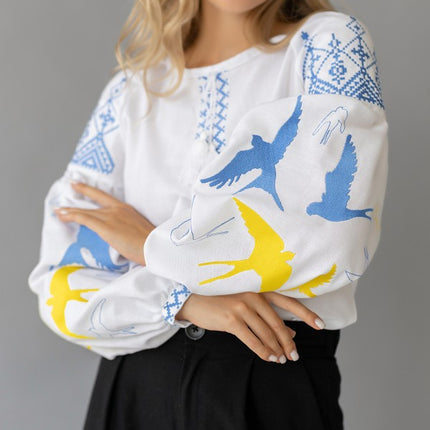 Women's embroidered blouse with swallows in Ukrainian style