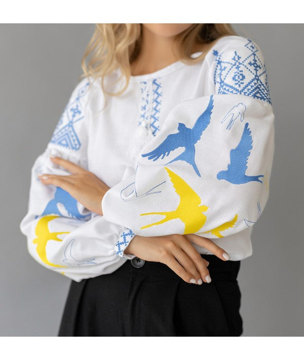 Women's embroidered blouse with swallows in Ukrainian style