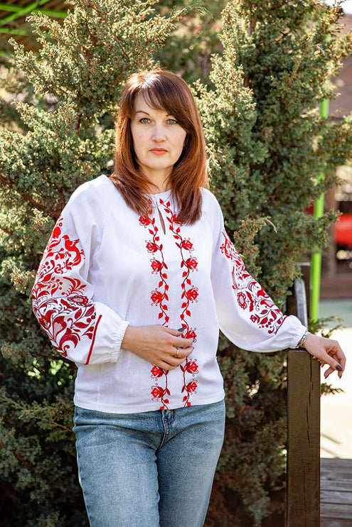 Women's embroidered shirt with a blooming ornament