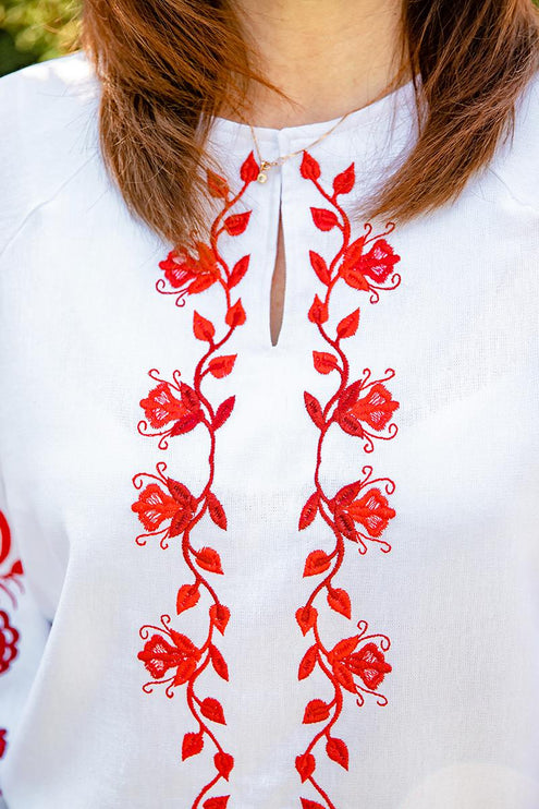 Women's embroidered shirt with a blooming ornament