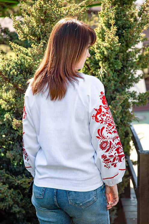 Women's embroidered shirt with a blooming ornament