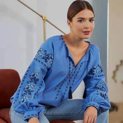 Embroidered women's blouse with a floral pattern