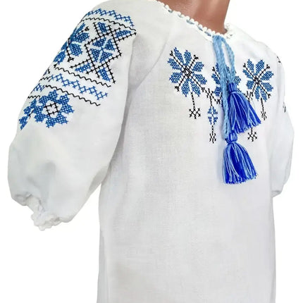 Embroidered blouse for a girl with a geometric ornament